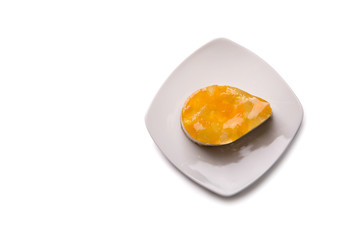 Cake with fruit jelly on plate, top view