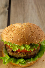 Burger on wooden plate