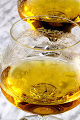 Glass of cognac on a marble table
