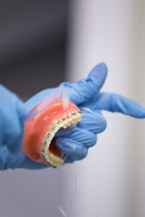 Teeth brace on artificial jaw