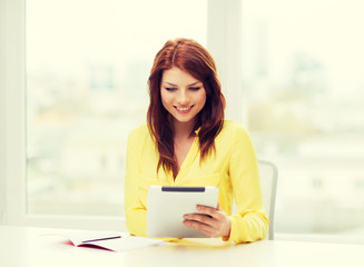 Obraz premium student with tablet pc computer and notebook