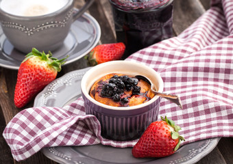Portion of cottage cheese casserole and cup of coffee