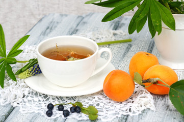 cup of tea with apricots and blueberry
