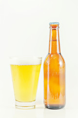 Mug fresh beer and Beer bottle on a white background