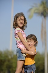 happy kids enjoying the summer rain