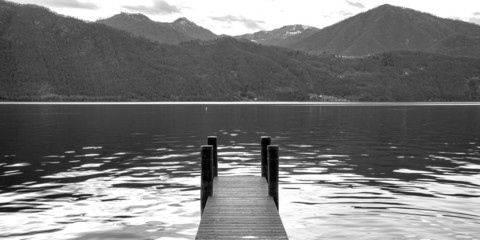 Orta lake pier. Black and white photo