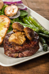 Steak and mushrooms with asparagus