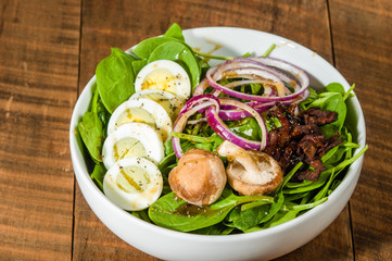 Egg and spinach salad close up