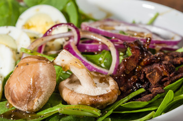 Egg and spinach salad close up