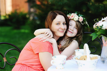 Portrait of beauty mother and  daughter outdoors