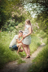 Fototapeta premium man listening pregnant belly