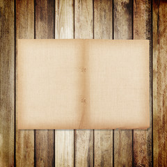 old paper on brown wood texture with natural linen texture