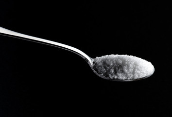 Teaspoon full of white sugar
