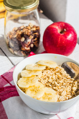 oatmeal with bananas, apples, nuts and dried fruit jar