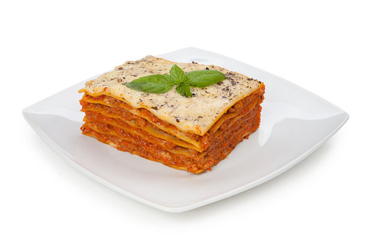 Tasty lasagna on a plate isolated on white background