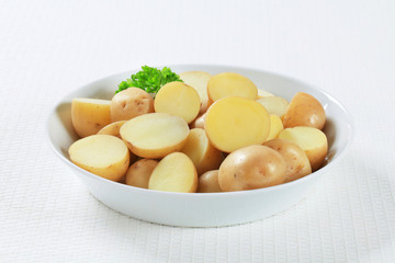Halved unpeeled potatoes