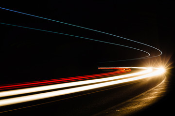 Car light trails in the tunnel.