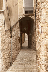 Fototapeta na wymiar The narrow streets of the ancient quarter in Girona