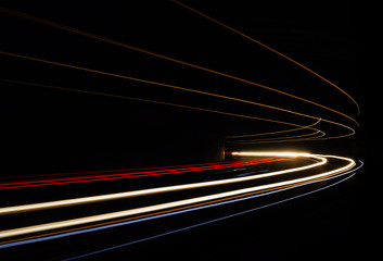 Car light trails in the tunnel.