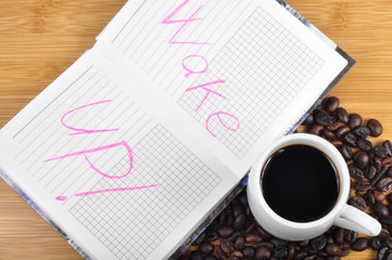 cup of coffee and wake up sign