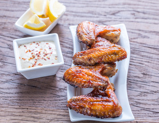 Baked chicken wings with spicy sauce