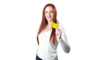 Young smiling redhead woman holding gold credit card