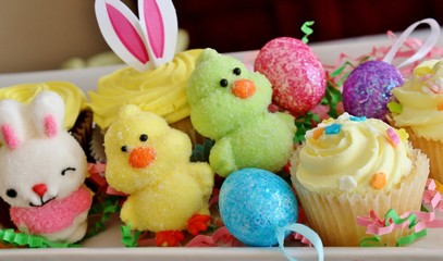 A variety of Easter themed candies and cupcakes