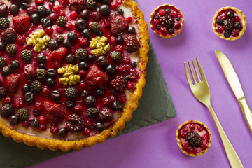 Autumn fruit cakes on a slate plate with golden fork and knife