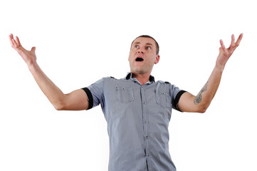 Fototapeta premium Portrait of young man with hands lifted upwards