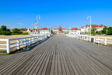 Fototapeta na wymiar Wooden pier in Sopot seaside town in summer, Baltic Sea, Poland
