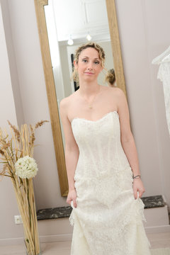 Beautiful young happy bride in a  white and ivory wedding dress