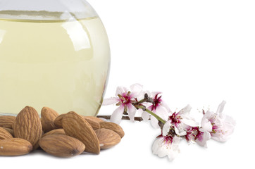 almond oil and almonds with flowers