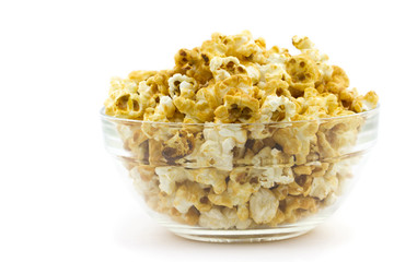 Caramel popcorn in a glass plate isolated on white background