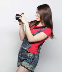 Beautiful young woman with camera
