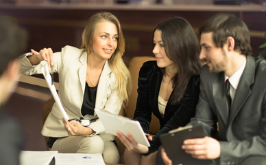 Image of business people listening and talking