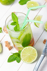 Mojito cocktail on wooden table closeup