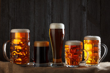 Beer glasses with lager, dark lager, brown ale, malt and stout