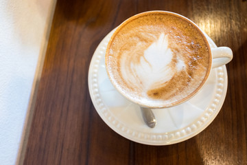 Beautiful latte art Coffee in withe cup