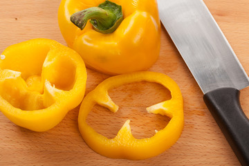 Cut yellow bell pepper on cutting board