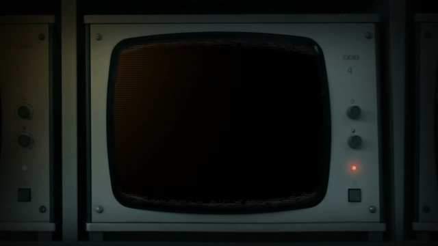 Hand Turns On TV Monitor - Pre-Keyed Empty Screen