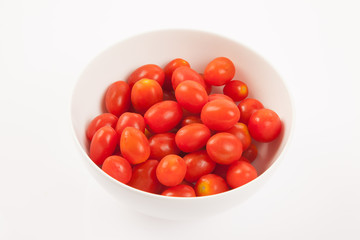 Red cherry tomatoes in a bowl