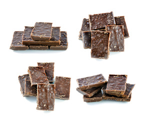 Broken milk chocolate bar isolated on white background