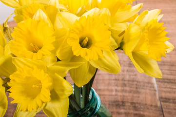 Bouquet of yellow daffodil flowers in a jar