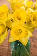 Bouquet of yellow daffodil flowers in a jar