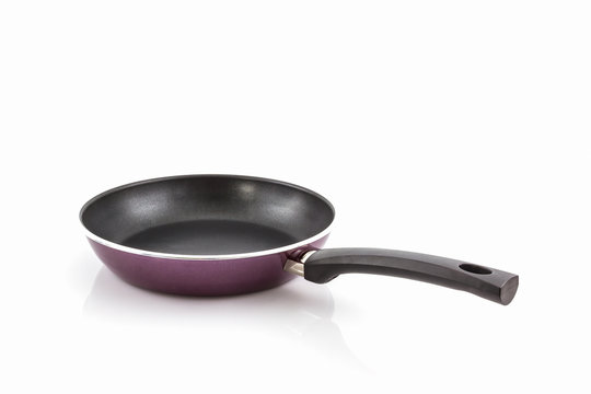 Black frying pan with handle .