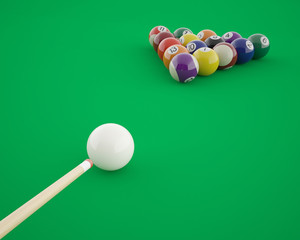Billiard balls before hitting on a green billiard table