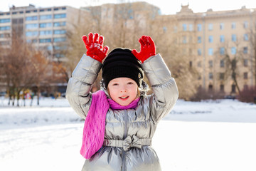 Portrait of little girl outdoors in winter