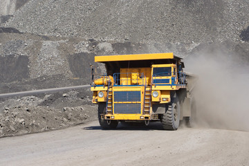 Coal mining. Yellow mining truck.
