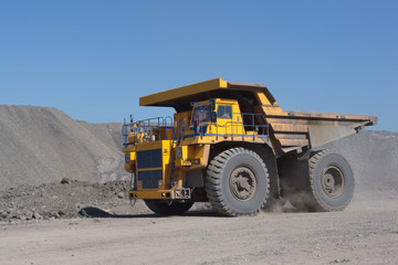 Fototapeta na wymiar Coal mining. Yellow mining truck.