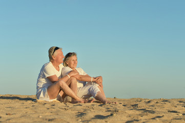 Fototapeta na wymiar Mature couple on beach